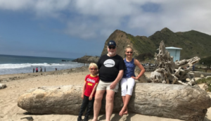 picture of population connection member Bob and grandkids at the beach.