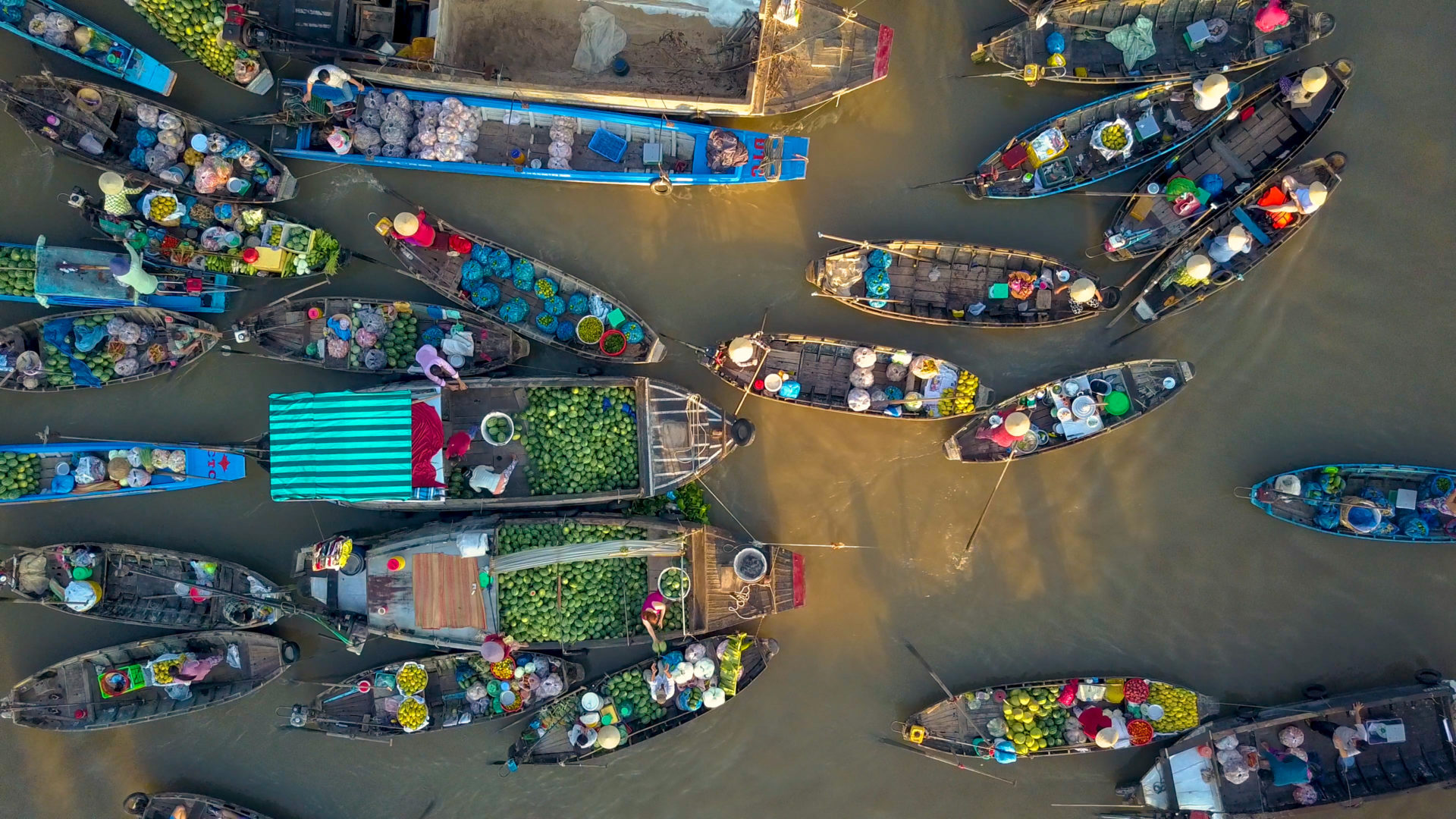Aerial view of local people buying and selling colorful produce from wooden boats, Vietnam. Adobe Photos