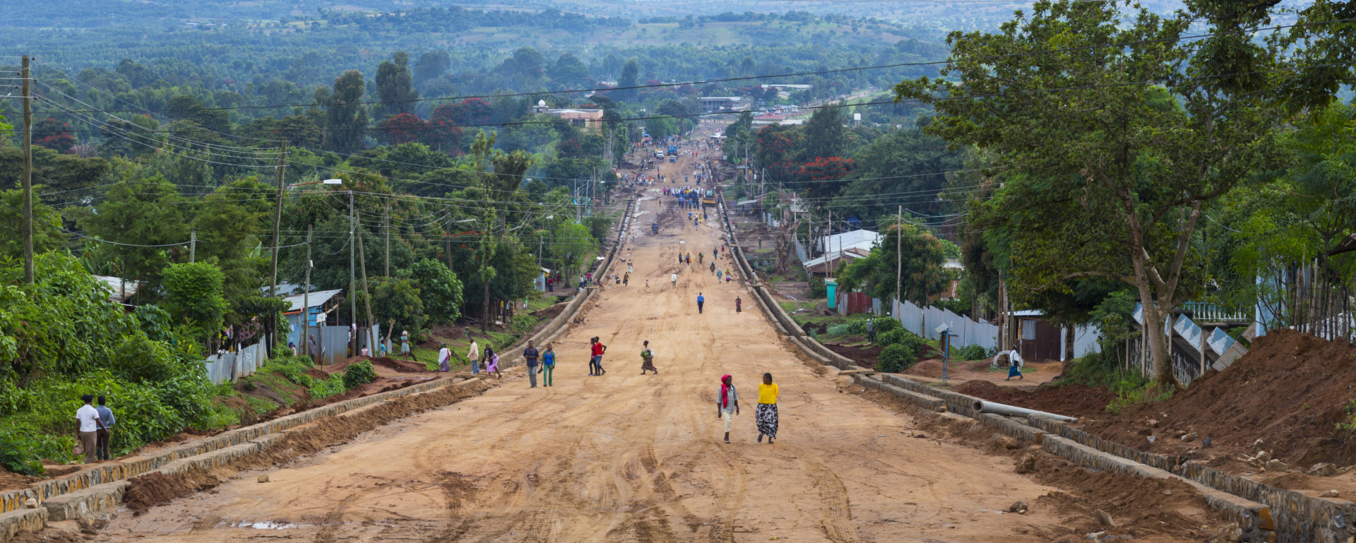People walking down main road in Jinka town, Naciones, Ethiopia, Africa