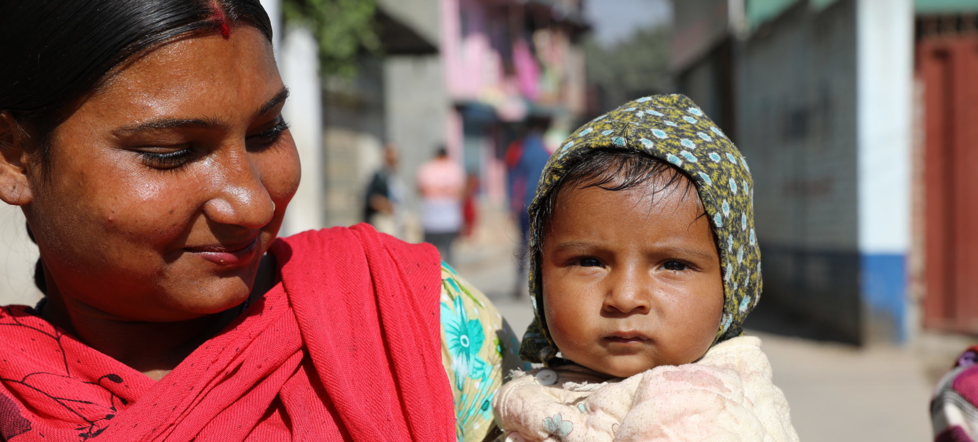 woman holding baby in Nepal