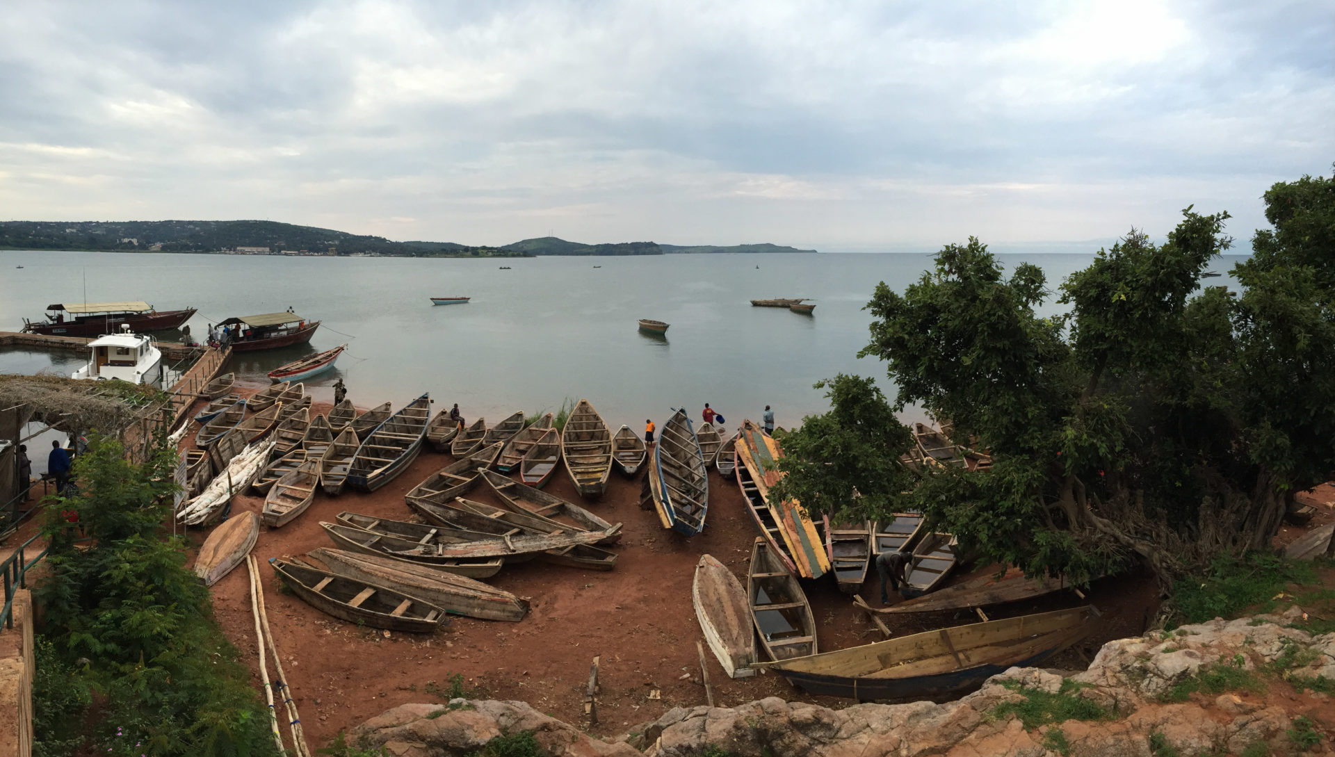 photo of Lake Tanganyika taken from shore, with boats in foreground