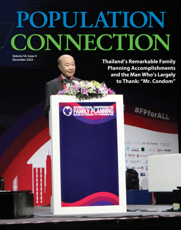 Thai man stands at conference podium