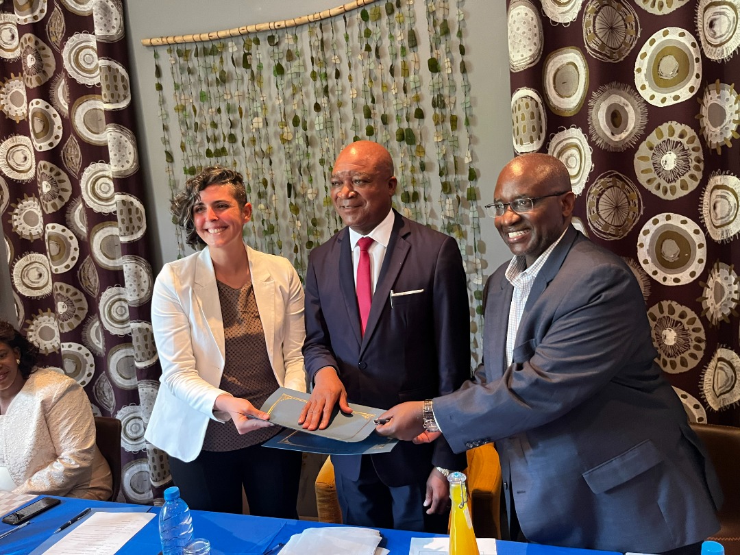 Julie-Anne, Zambian Minister of Education Hon. Douglas Syakalima MP and Dr. Steady Moono, SUNY Schenectady Community College President, sign an agreement to provide full scholarships to two Zambian students each year starting in Fall 2022.