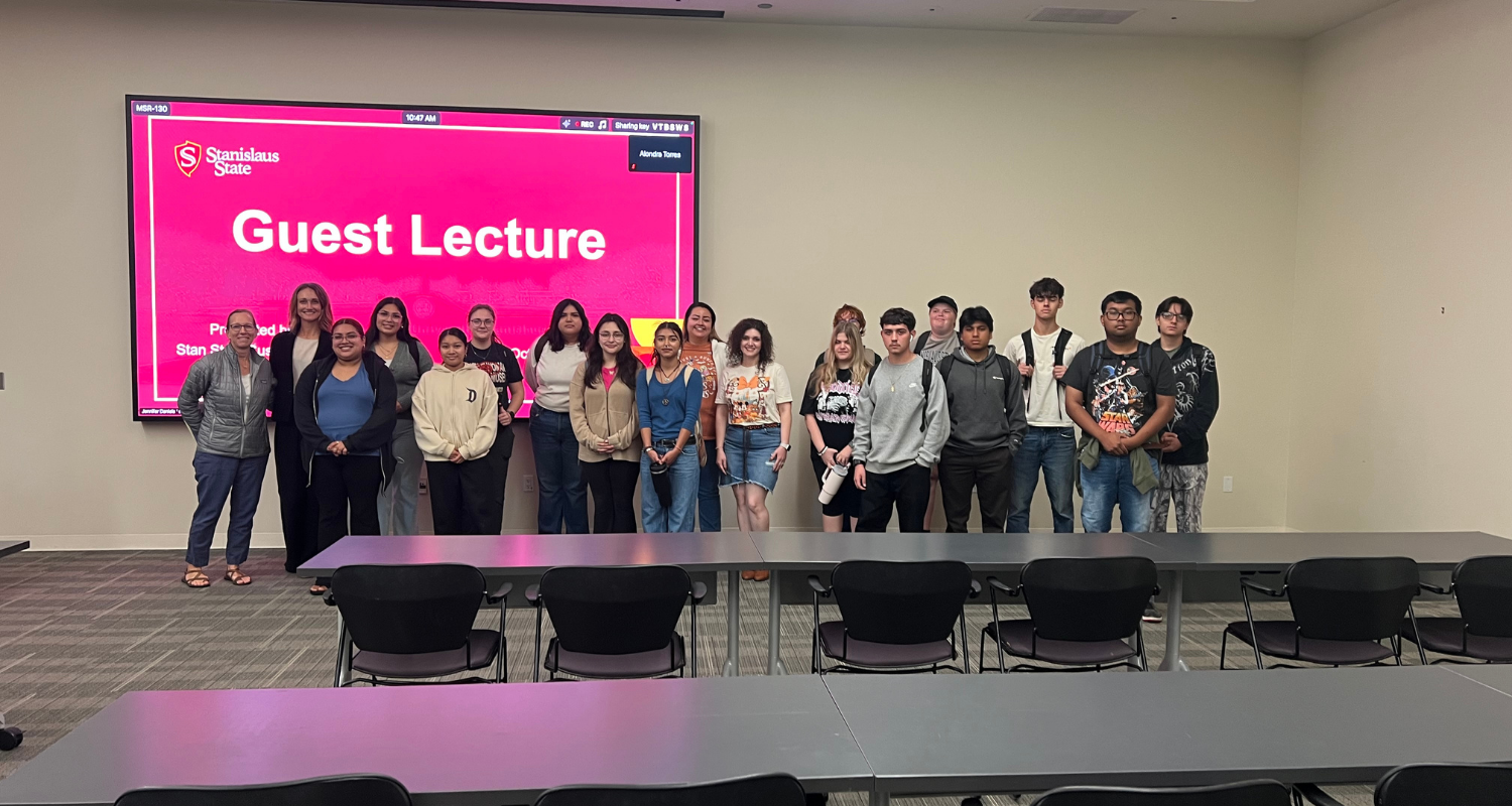 Group photo of Stanislaus State students after a presentation with Population Connection Senior Analyst, Hannah Evans
