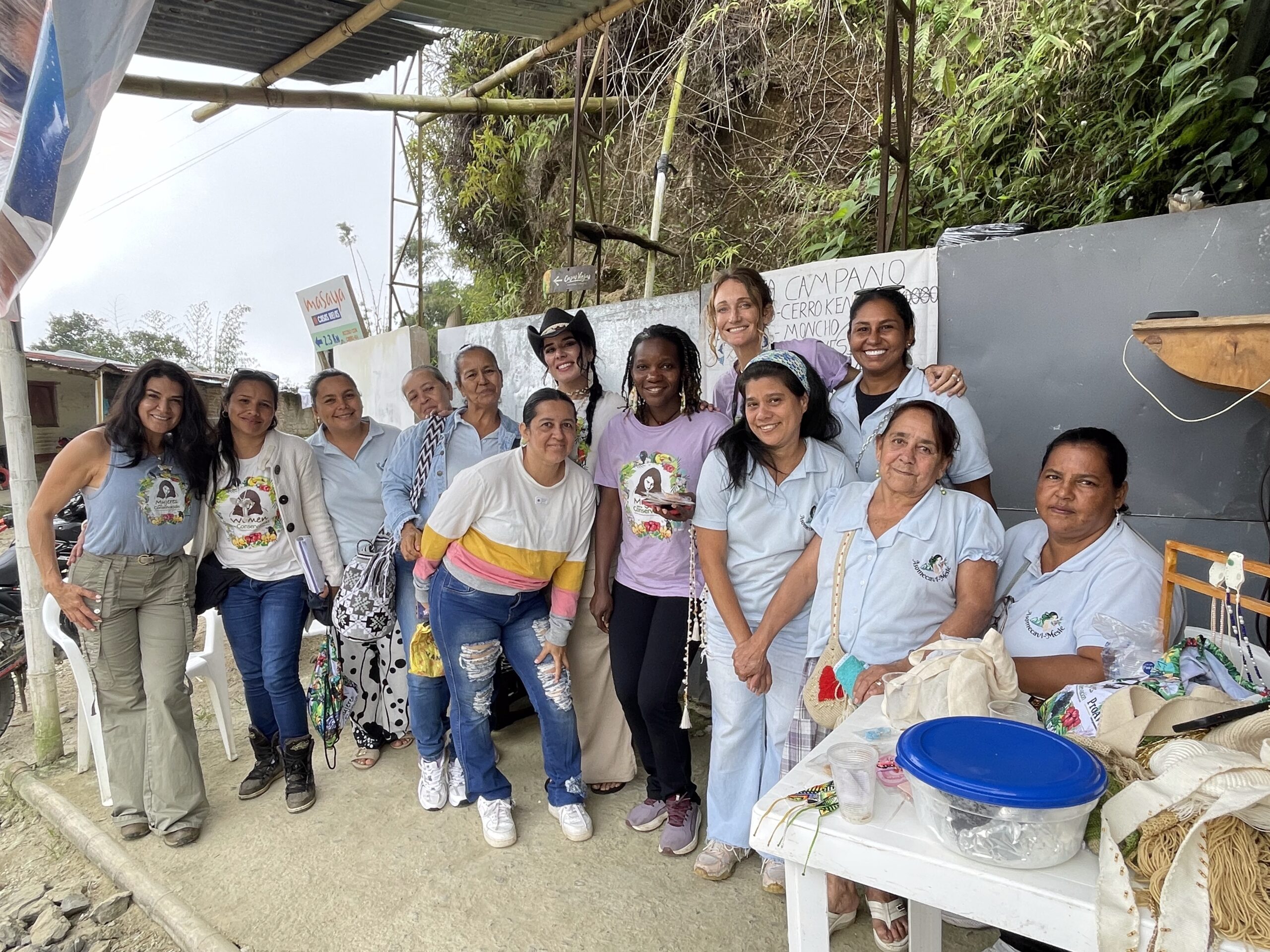 Hannah, Florence, and the Women for Conservation team with the women's collective in Campano.