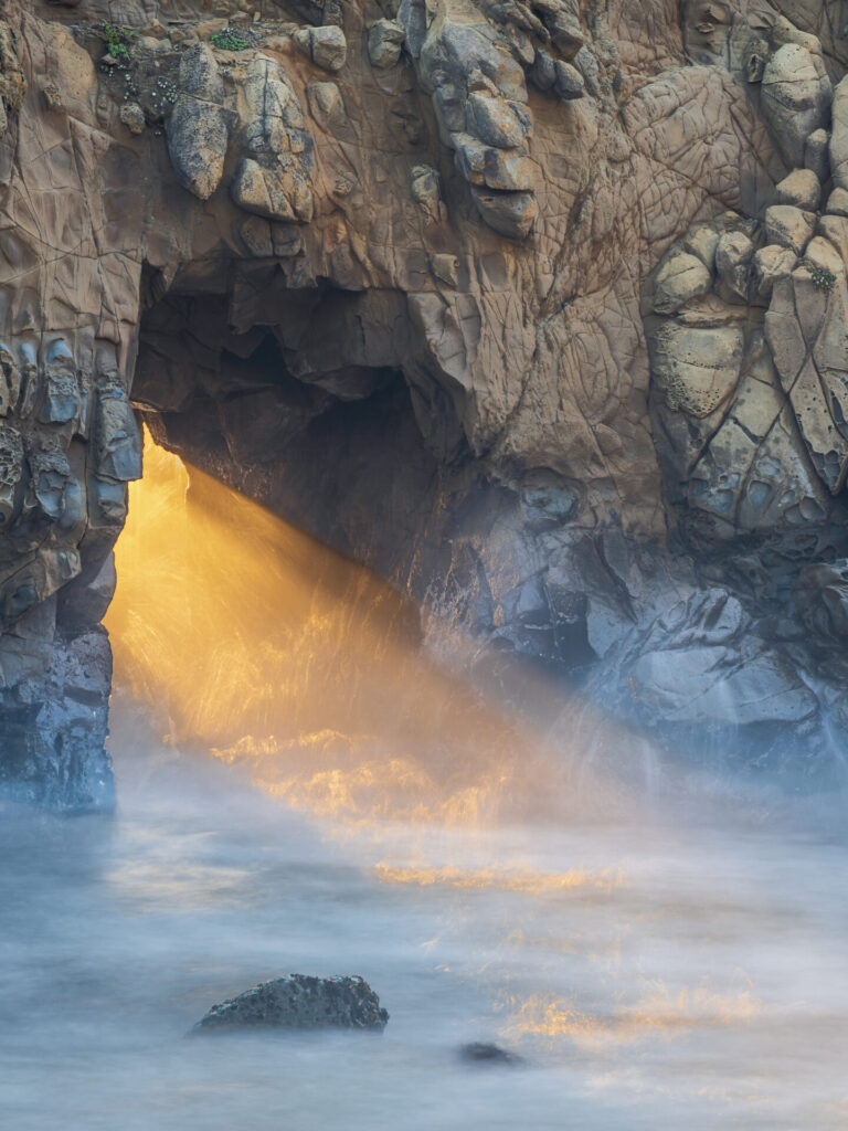 Late afternoon sun streams through the Keyhole Arch at Pfeiffer Beach in Big Sur, California. Submitted by: Steve Harris