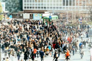 A big crowd crosses a road in Tokyo